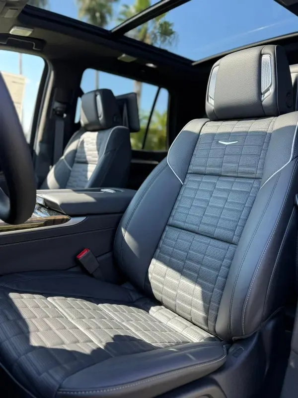 Interior view of a black Cadillac SUV.