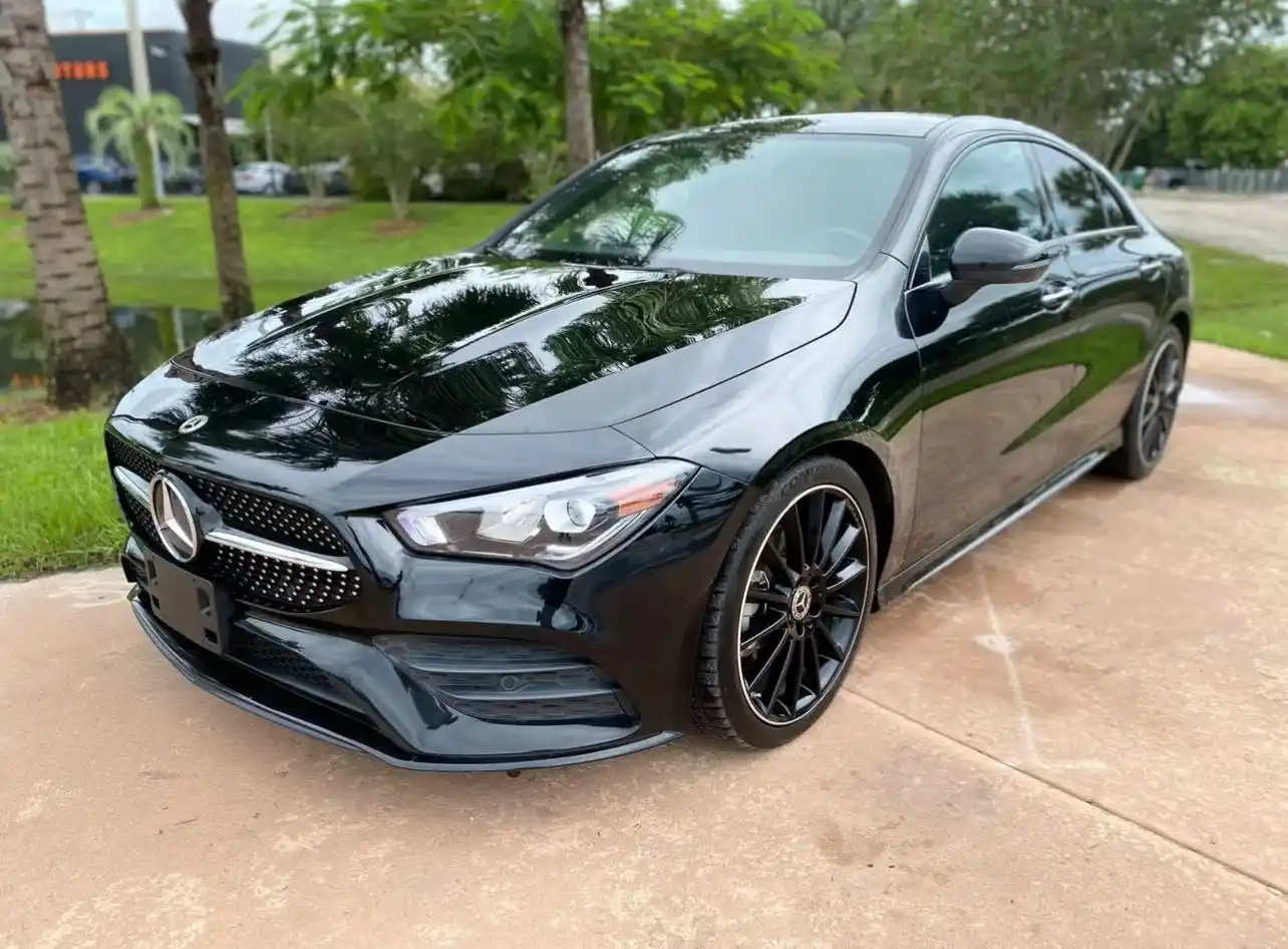 Black Mercedes-Benz luxury car shown in a side pose view, parked outside for premium chauffeur transportation — Car services miami.
