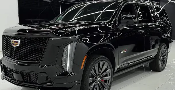 Black luxury Cadillac being professionally washed, representing a clean and comfortable chauffeur fleet — Car services miami.
